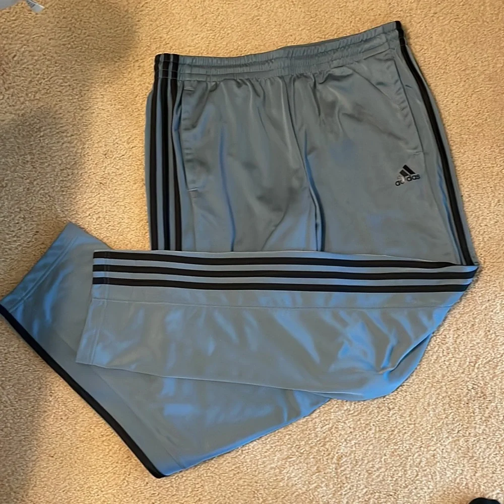 Adidas Men’s Joggers. Blue/grey color with black stripes.
